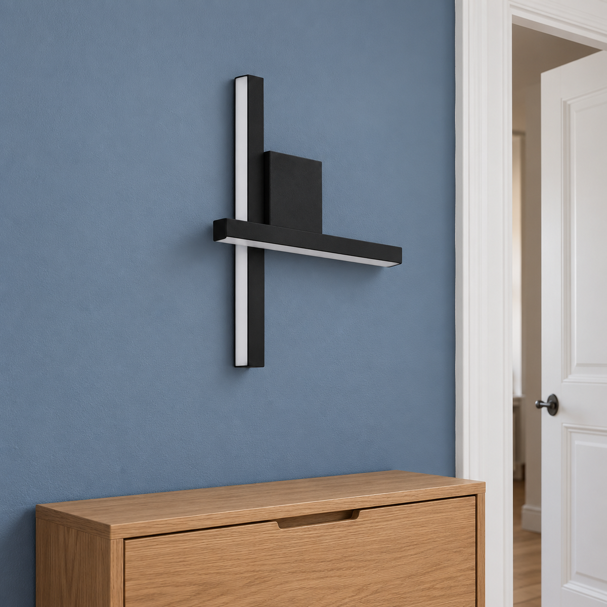 Applique murale lignes LED croisées noire dans une entrée bleue